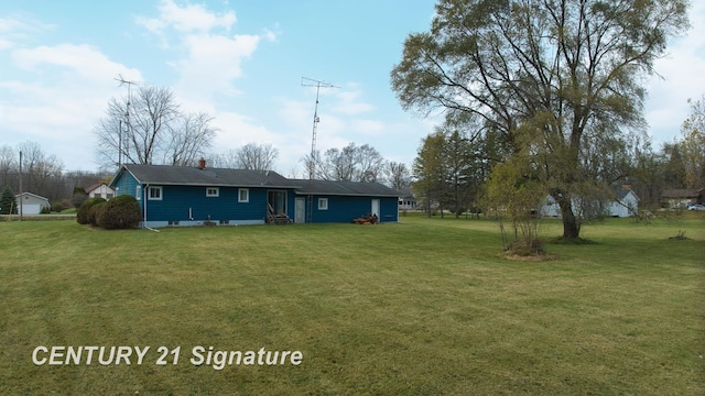8168 Vassar Rd, Mount Morris, MI 48458 - rear view of property featuring entry steps, a lawn, and a chimney