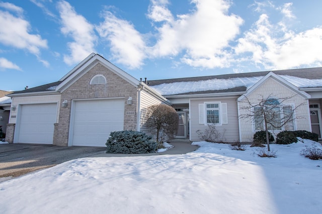 single story home featuring a garage