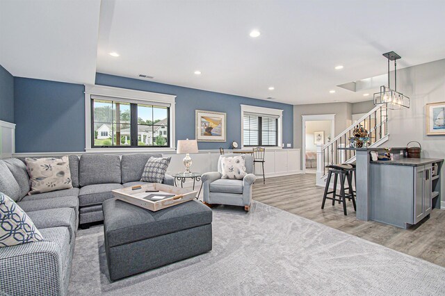 5405 Harborview Pass, Kalamazoo, MI 49009 - living area featuring stairway, light wood-type flooring, plenty of natural light, recessed lighting, and a chandelier
