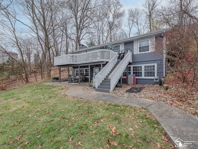 11477 Highland Hills Dr, Jerome, MI 49249 - view of front of property featuring stairs, a wooden deck, a front yard, and a patio area