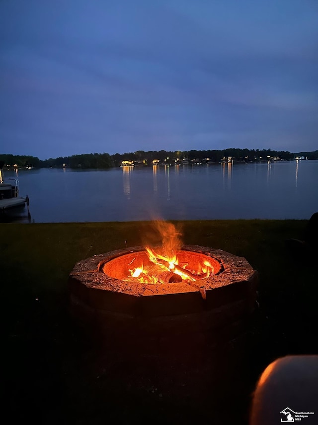 11477 Highland Hills Dr, Jerome, MI 49249 - water view featuring an outdoor fire pit