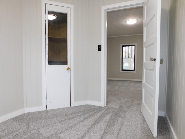 hallway featuring light carpet