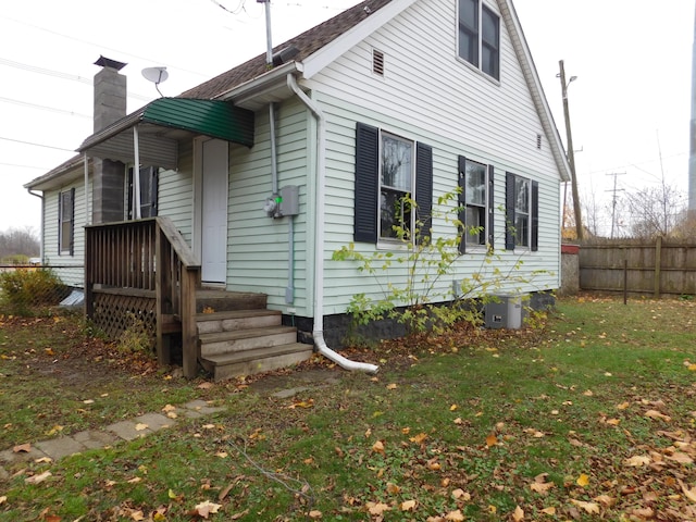 view of home's exterior with a yard