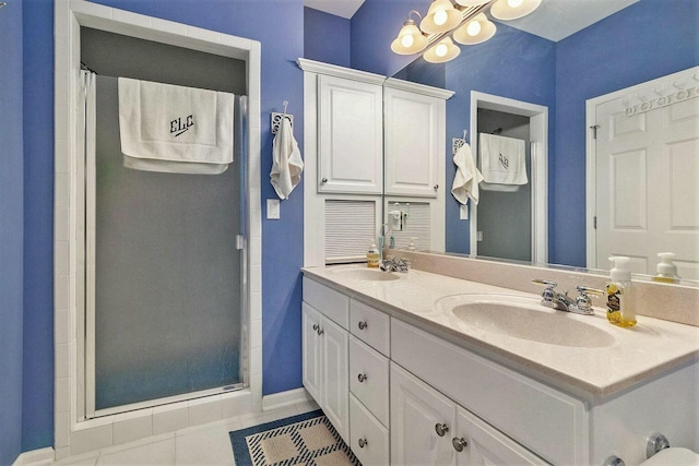 bathroom featuring tile patterned flooring, vanity, and a shower with shower curtain