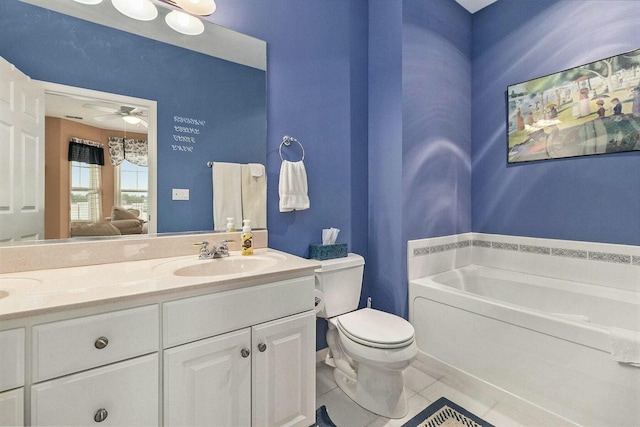 bathroom featuring a bathing tub, ceiling fan, tile patterned floors, toilet, and vanity