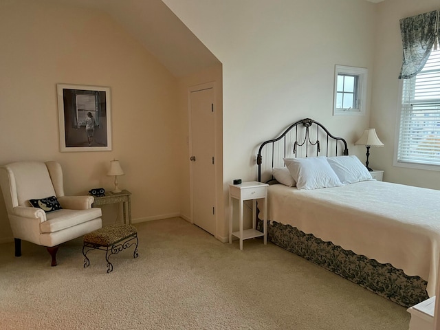 bedroom with light carpet and lofted ceiling