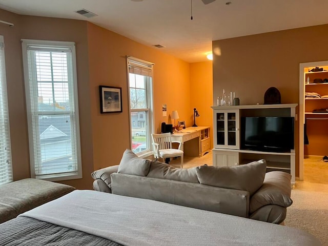 carpeted living room featuring plenty of natural light