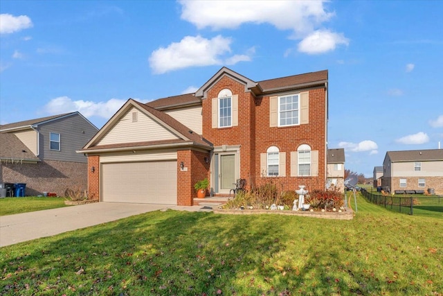 view of front of property featuring a front yard and a garage