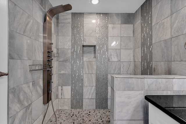 bathroom featuring tiled shower