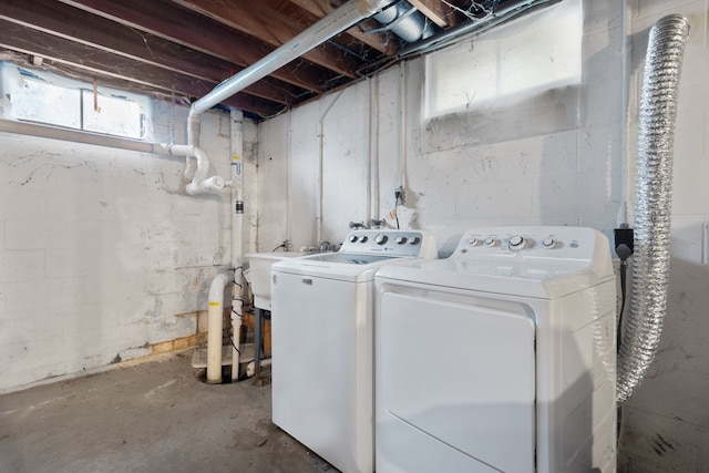 laundry area featuring separate washer and dryer and sink