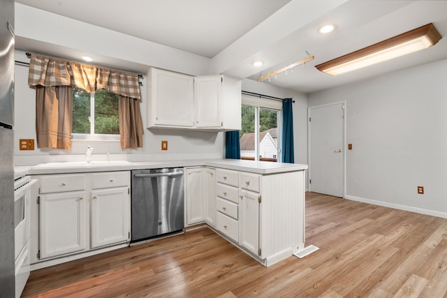 kitchen with kitchen peninsula, light wood-type flooring, white cabinets, sink, and dishwasher