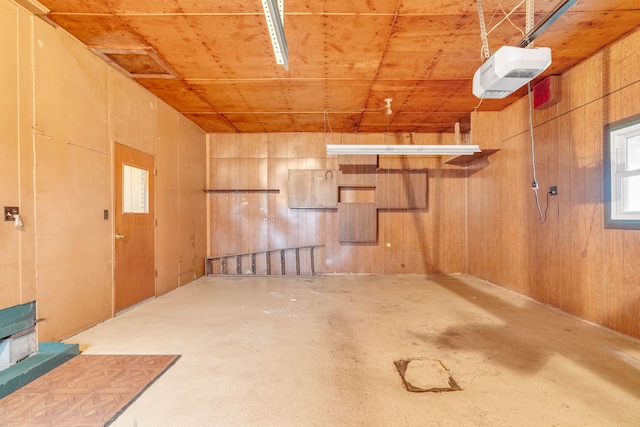 basement featuring wooden ceiling and wooden walls