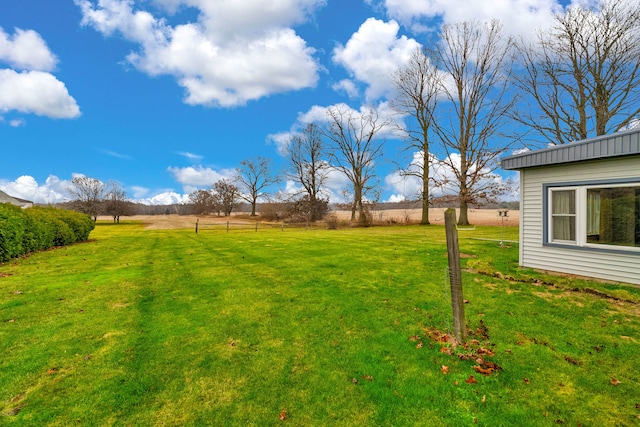 view of yard with a rural view