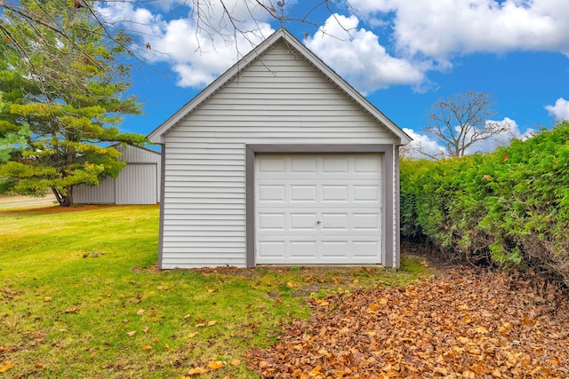 garage with a lawn