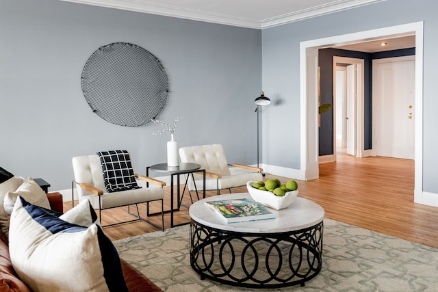 sitting room featuring light hardwood / wood-style floors and ornamental molding