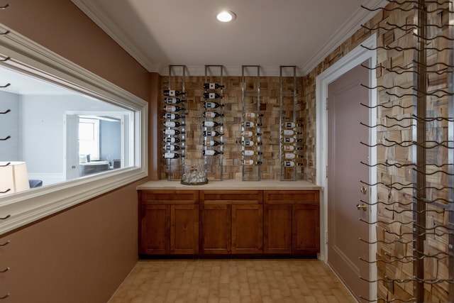 wine room featuring ornamental molding