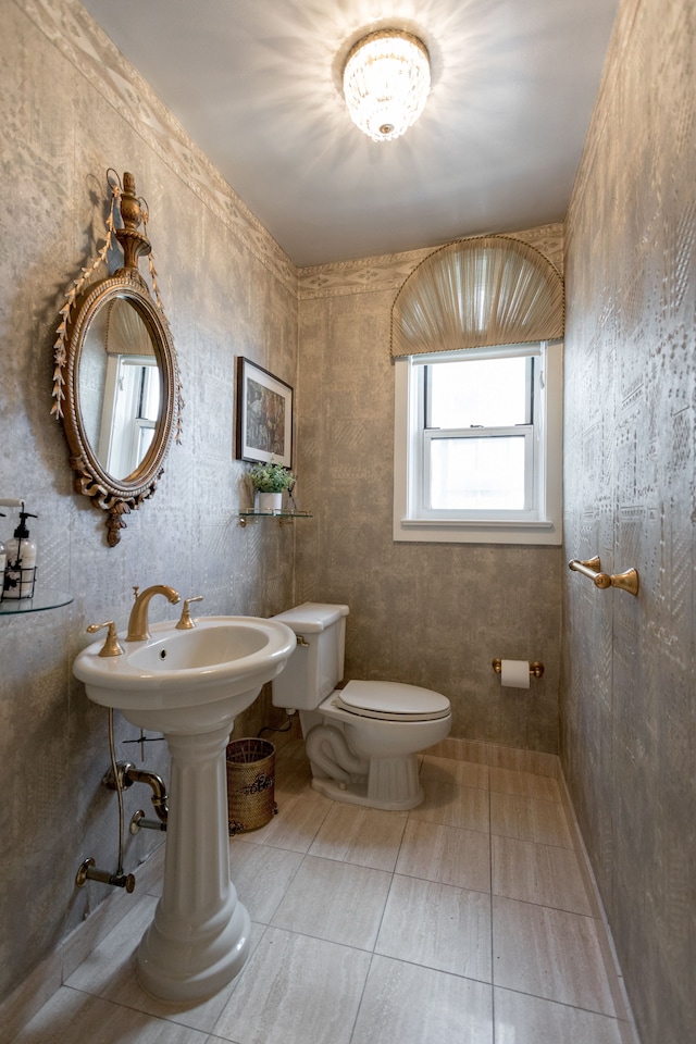 bathroom with tile patterned flooring and toilet