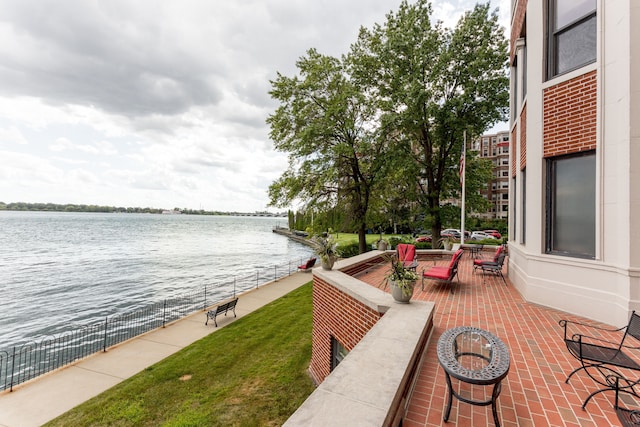 view of patio with a water view