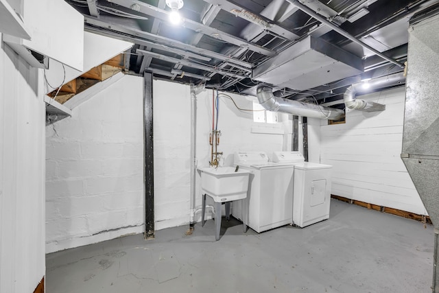 basement featuring sink and washing machine and dryer