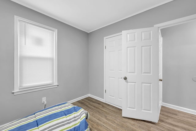 bedroom with wood-type flooring