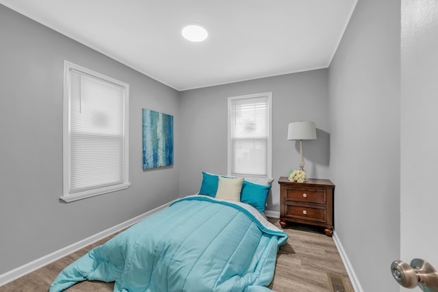 bedroom with light hardwood / wood-style floors