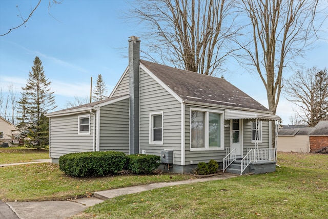 5570 Meadow View St, Sterling Heights, MI 48310 - view of front of home with a chimney, a front lawn, and a shingled roof