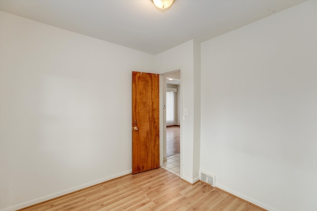 unfurnished room featuring light hardwood / wood-style flooring