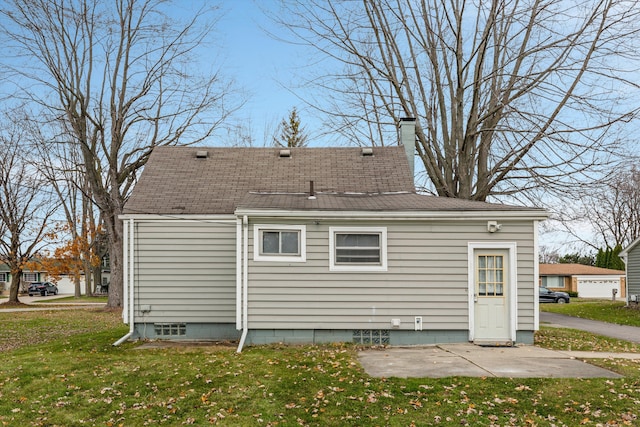 5570 Meadow View St, Sterling Heights, MI 48310 - rear view of house with a lawn, a chimney, and roof with shingles
