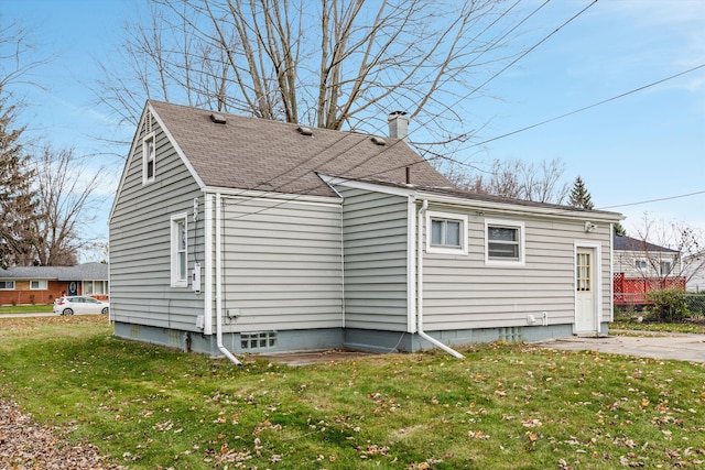 5570 Meadow View St, Sterling Heights, MI 48310 - back of property with a yard, a chimney, and roof with shingles