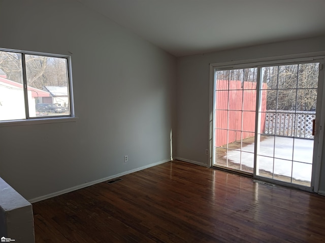 spare room featuring dark hardwood / wood-style floors