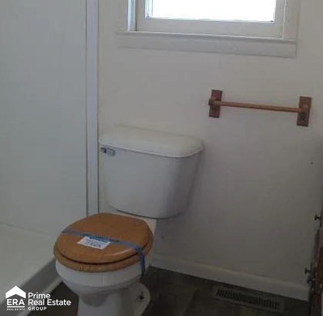 6458 Summit St, Mount Morris, MI 48458 - bathroom with toilet and baseboards