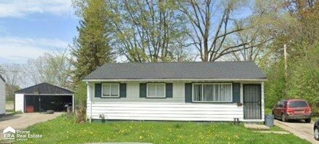 view of front of property with a front lawn and a carport