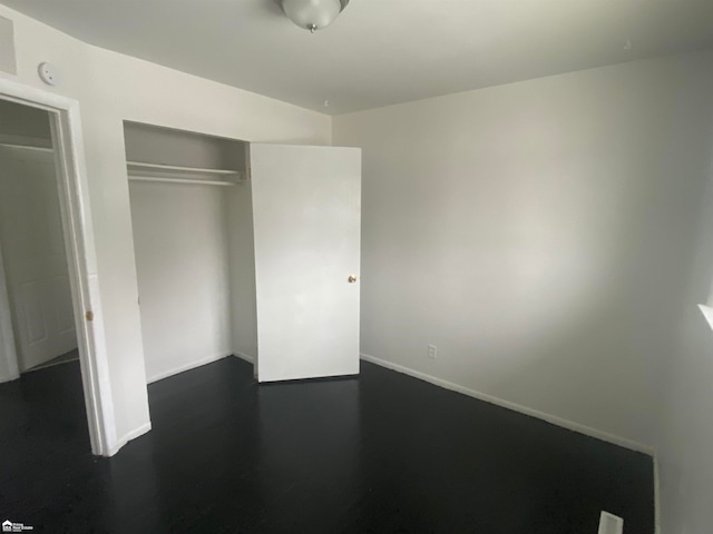 unfurnished bedroom with a closet