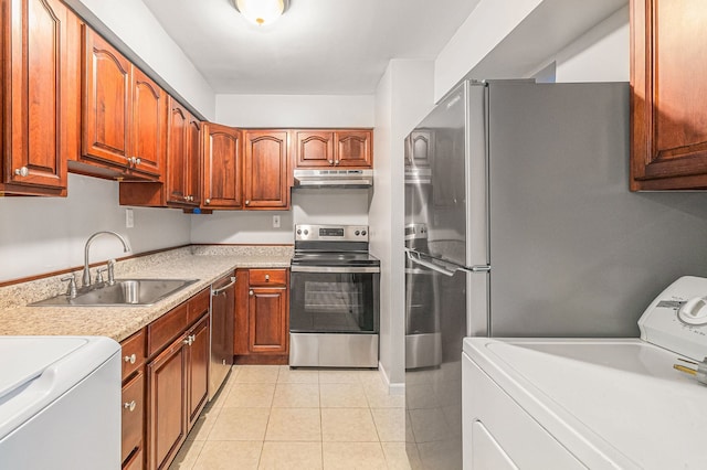 kitchen with light tile patterned floors, washer / clothes dryer, sink, and appliances with stainless steel finishes