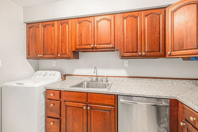 kitchen with dishwasher, sink, and washer / clothes dryer