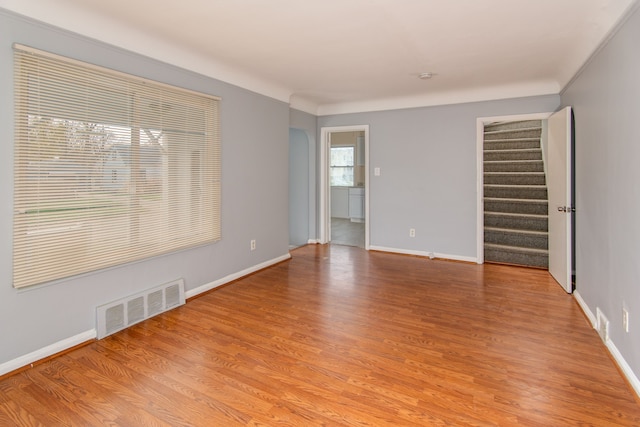 spare room with light hardwood / wood-style flooring