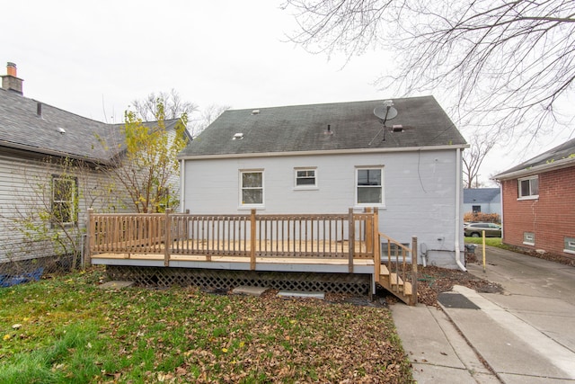 rear view of property featuring a deck