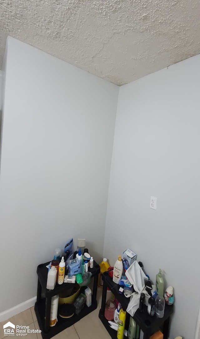 1084 Dunkirk Ave, Mount Morris, MI 48458 - interior space featuring a textured ceiling and tile patterned floors