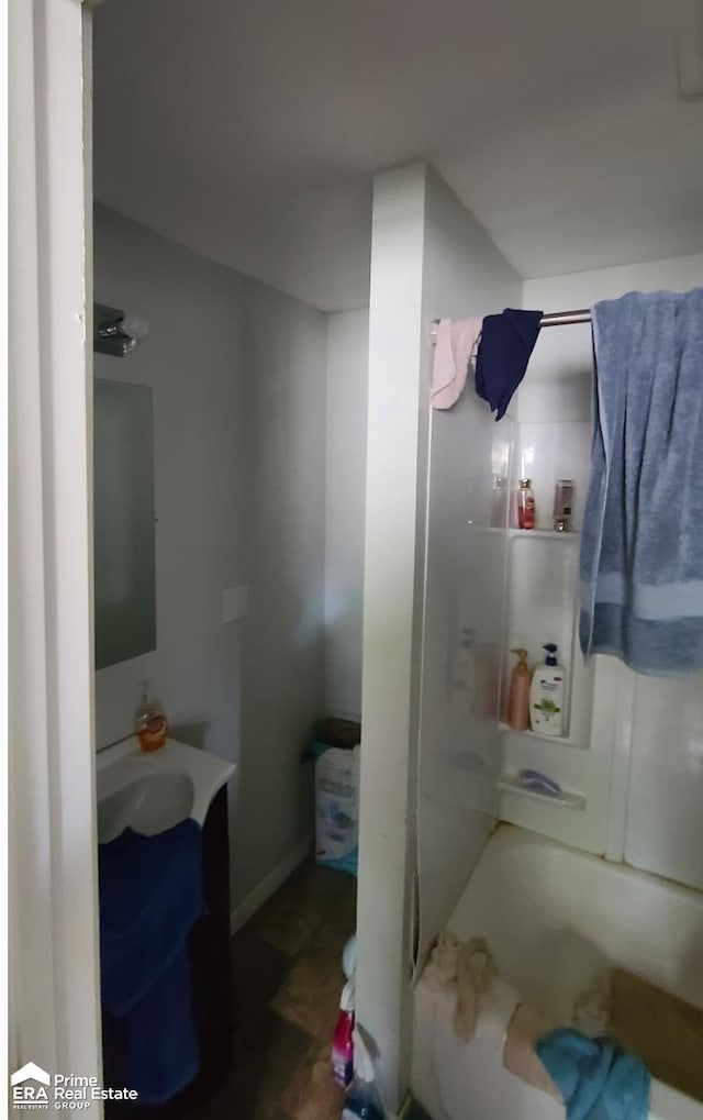 bathroom with bathing tub / shower combination