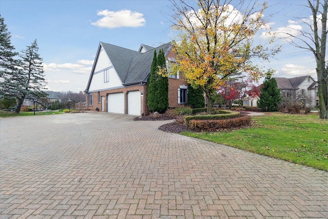 view of side of property with a garage