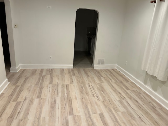 spare room with light wood-type flooring