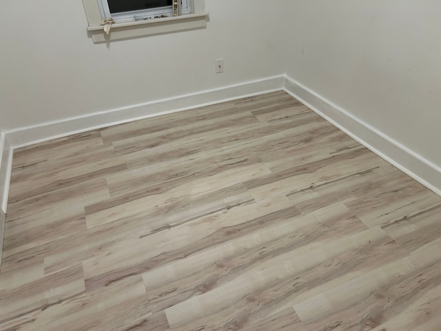 empty room with light wood-type flooring