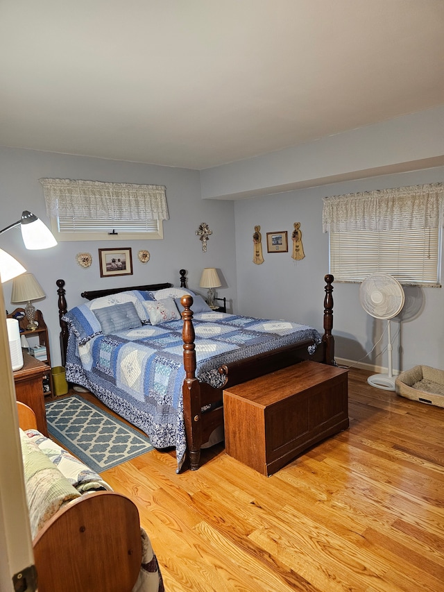 bedroom with hardwood / wood-style floors