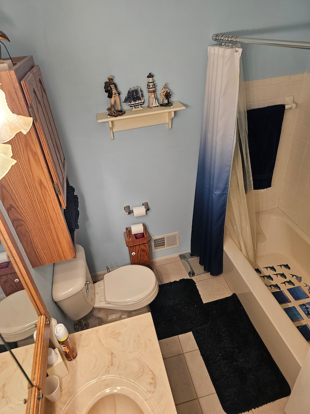 bathroom featuring tile patterned floors, walk in shower, vanity, and toilet