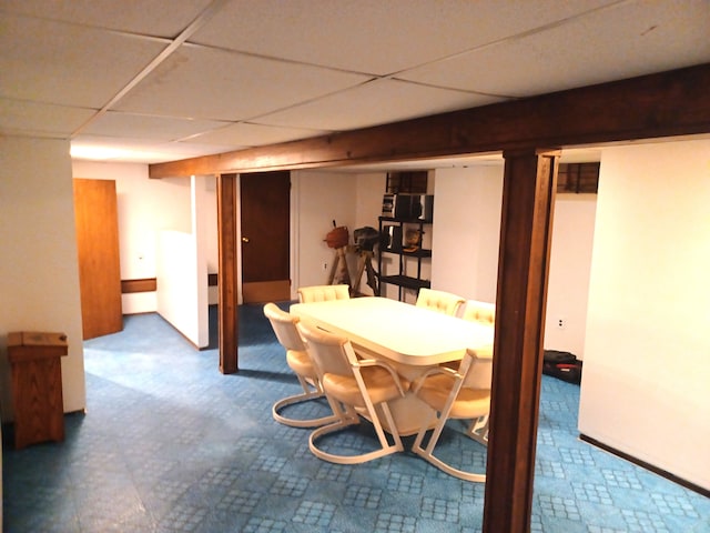 dining room featuring a drop ceiling