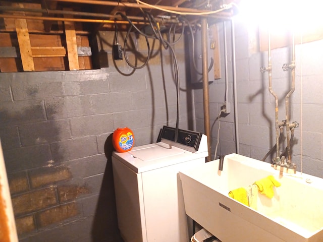 laundry room featuring sink and washer / clothes dryer