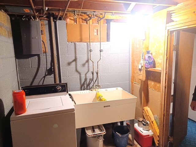 washroom featuring washer / clothes dryer, electric panel, and sink