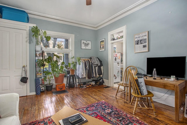 office featuring ceiling fan, ornamental molding, and dark hardwood / wood-style flooring