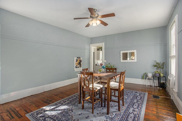 dining room with dark hardwood / wood-style floors and ceiling fan