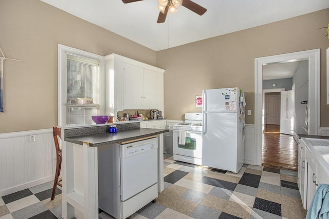 kitchen featuring ceiling fan, white appliances, and white cabinets